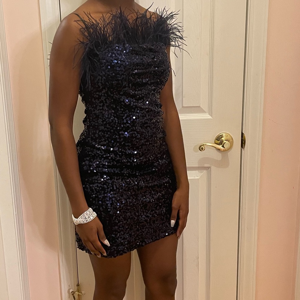 Navy blue sequin strapless dress made by B.Darlin with feathers.